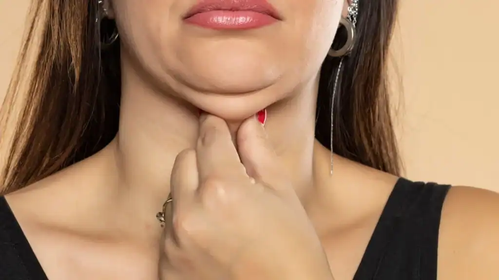 An image of a woman with double chin, sad, worried : Non Surgical Double Chin Removal Treatment in Hythe, UK